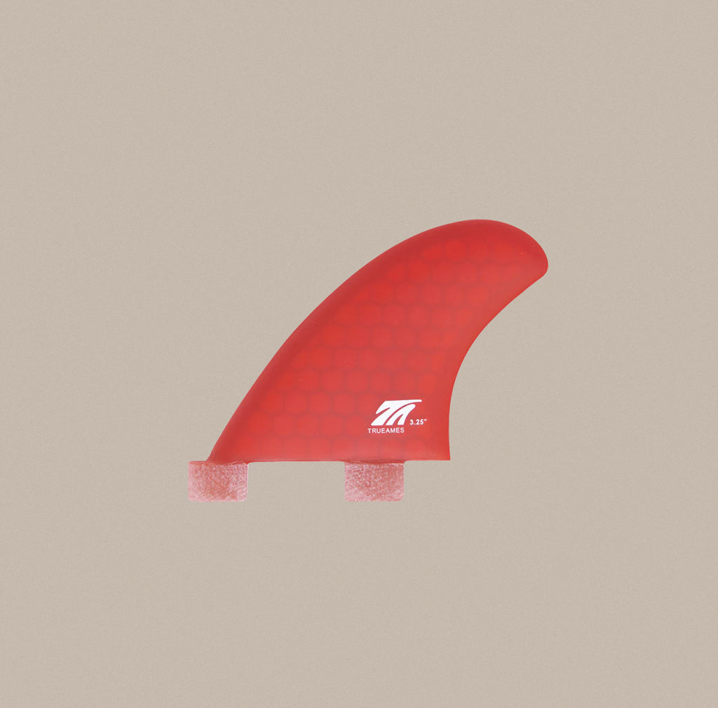 A True Ames 3.25" Side Bite FCS fin set in red hexcore.