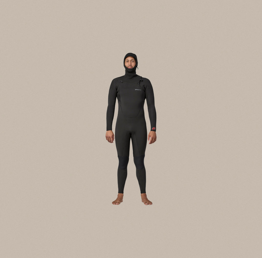 A model wearing the Patagonia Men's R4 Yulex Regulator full wetsuit.