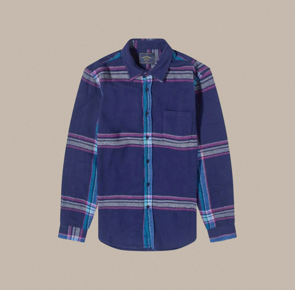 The Trim Shirt is a blue cotton button down from Portuguese Flannel. 