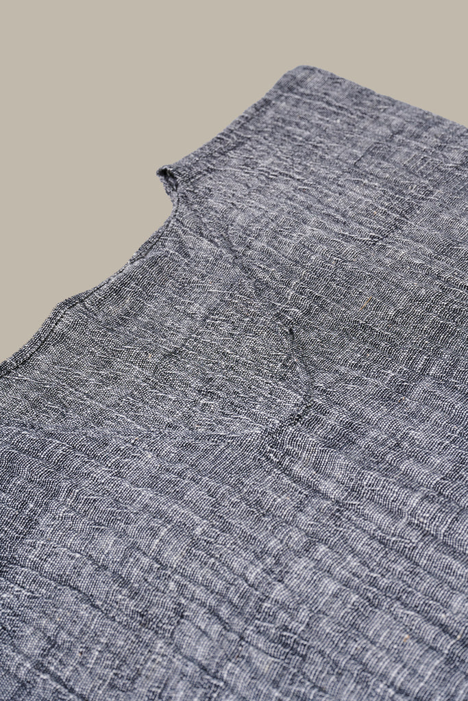 Close up detail of the cotton weave on the Khadi Oaxaca Dress in Black.